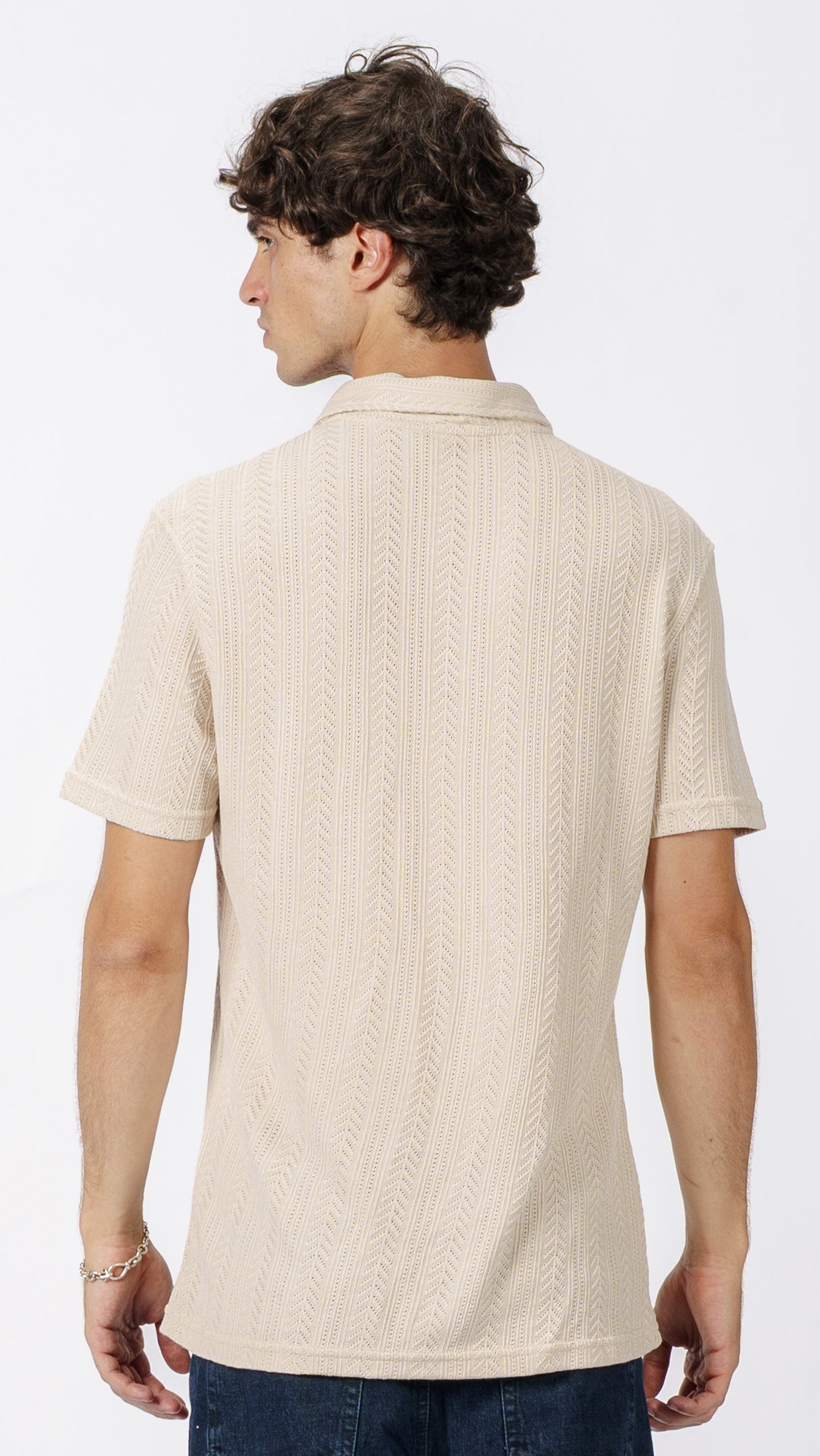 Beige polo T-shirt with a subtle pattern