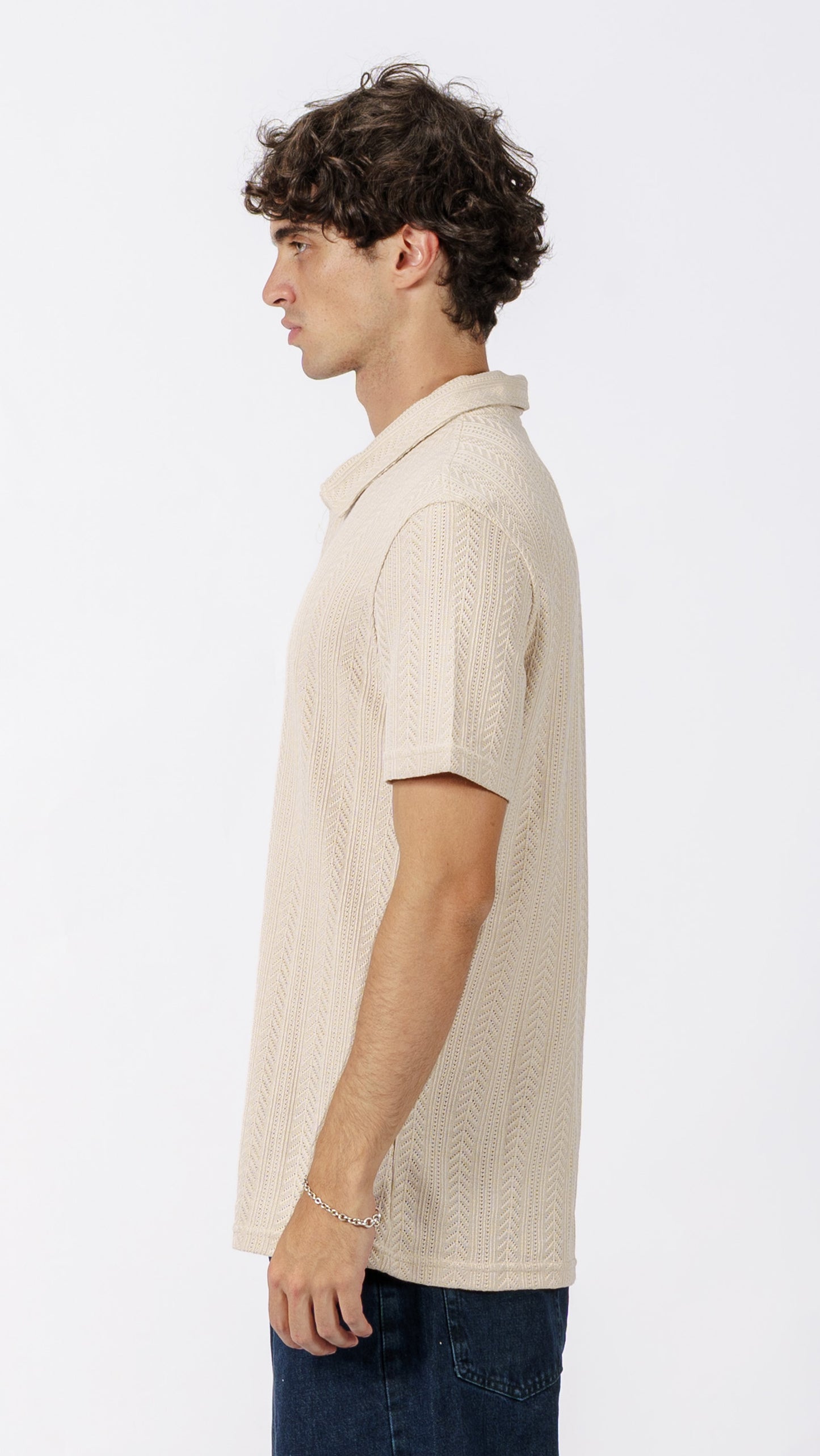 Beige polo T-shirt with a subtle pattern