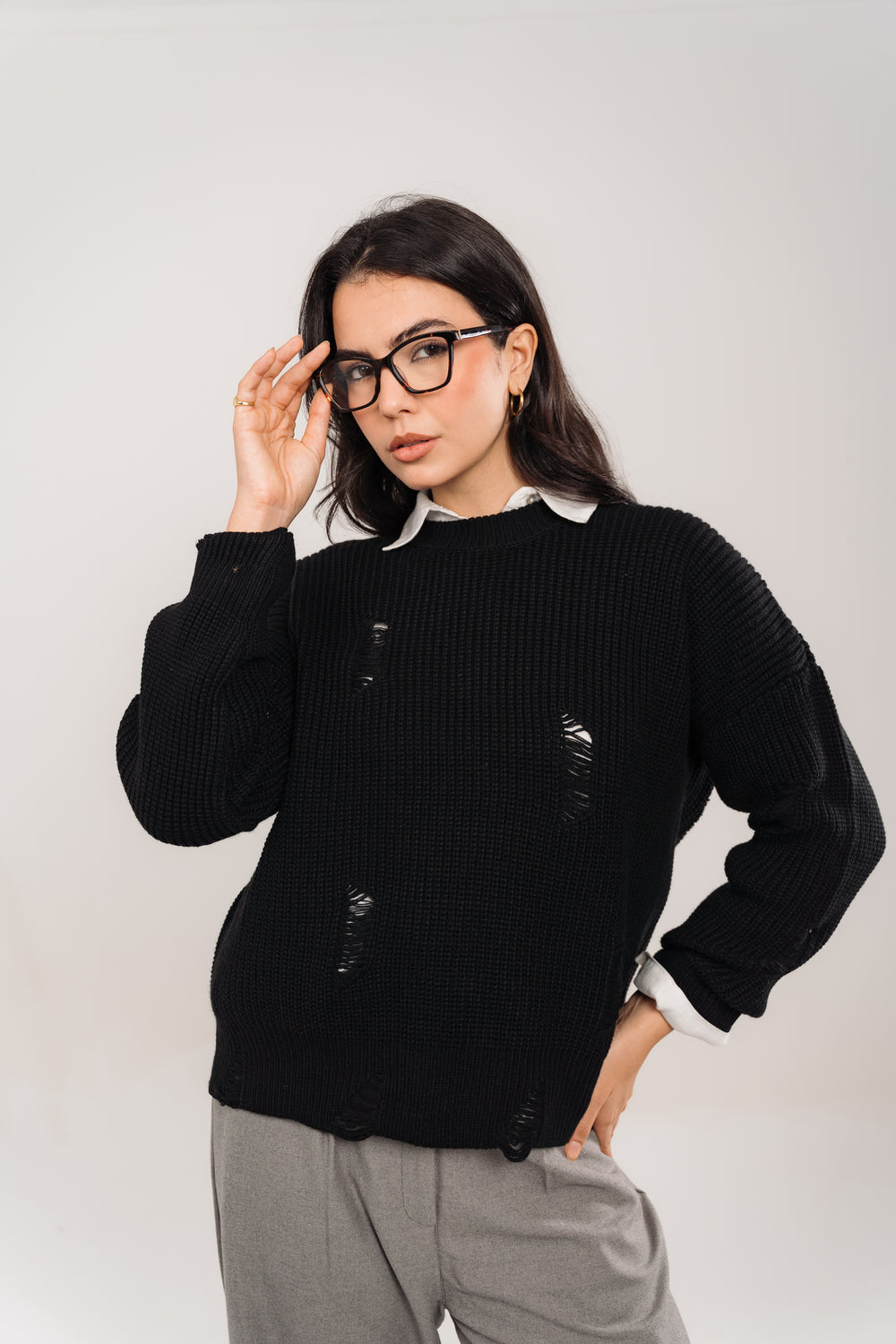 distressed knit sweater In Black